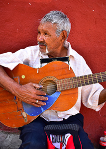 Street Musician, San Miguel, Mexico by Michael Shoemaker